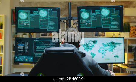 Happy hacker gets access granted after a dangerous cyber attack. Identity theft. Stock Photo