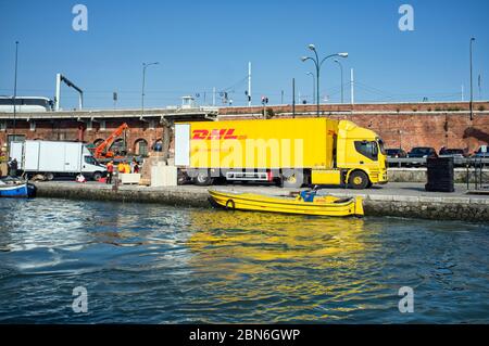 10 may 2019, Venice, Italy - DHL ( DHL Express Delivery Services & International Shipping) operations during the unloading and loading phases in Venic Stock Photo