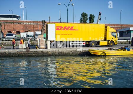 10 may 2019, Venice, Italy - DHL ( DHL Express Delivery Services & International Shipping) operations during the unloading and loading phases in Venic Stock Photo