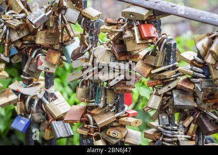 Zagreb, Croatia - 01 May, 2020 : Close up of locks on the fence next to a kissing spot on the street of upper old Town of Zagreb, Croatia. Stock Photo