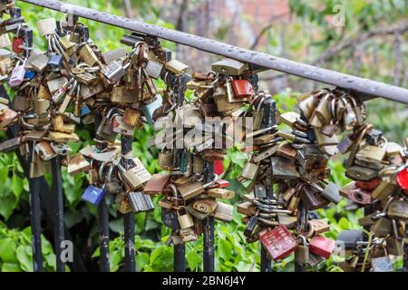 Zagreb, Croatia - 01 May, 2020 : Close up of locks on the fence next to a kissing spot on the street of upper old Town of Zagreb, Croatia. Stock Photo