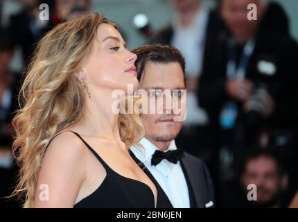 Johnny Depp and Amber Heard attends the 'Black Mass' red carpet during the  72nd Venice Film Festival on September 4, 2015 in Venice, Italy Stock Photo 