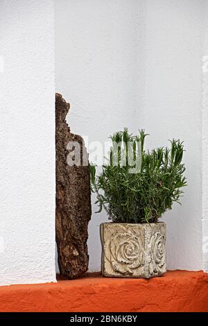tasteful decoration in a white, iron red painted house wall Stock Photo