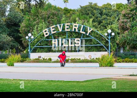 Man Cleaning Beverly Hills Fountain Stock Photo