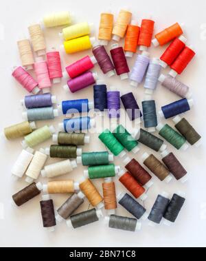 A bunch of colorful threads on a white background Stock Photo