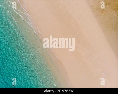 Traveller on Zanzibar. Empty beach at Snow-white sand bank of Nakupenda Island. Appearing just a few hours in a day. Aerial drone shot Stock Photo