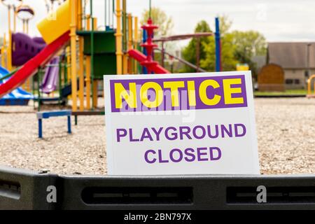 Playground closed sign due to social distancing, lockdown restrictions during Covid-19 coronavirus pandemic Stock Photo