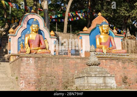 Golden Buddha Statues, Swayambhunath stupa, Kathmandu Nepal Stock Photo