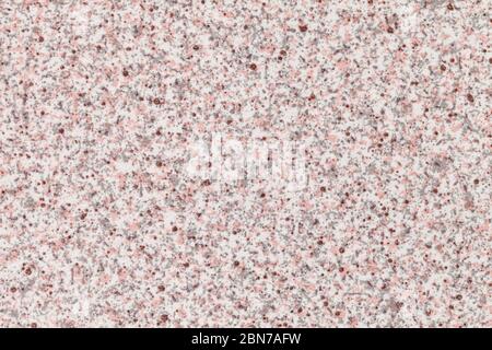 Grainy white background with pink and gray spots. Texture backdrop with small crumb pattern for interior design and kitchen countertop. Stock Photo