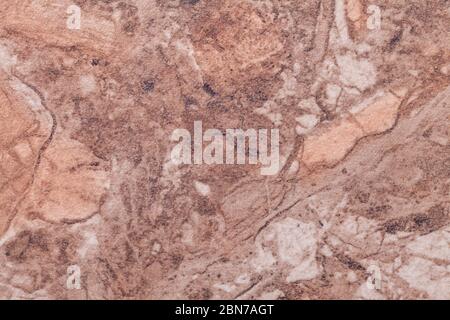 Texture of dark brown marble with pattern, macro background. Umber stone backdrop from mineral tile, closeup. Stock Photo