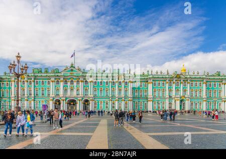 Saint Petersburg, Russia, August 3, 2019: The State Hermitage Museum building, The Winter Palace official residence of the Russian Emperors and people tourists are walking on Palace Square