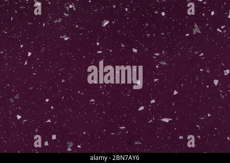 Grainy dark purple background with silver shiny spots from foil sparkles. Wine texture backdrop with small crumb pattern for interior design and kitch Stock Photo