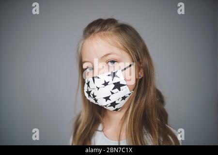beautiful young girl with self-made mouth mask Stock Photo