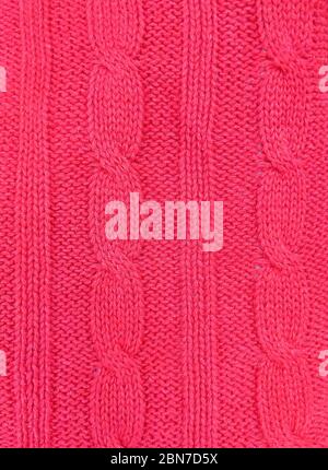 Pink knitted texture background. Pattern of wool knitting for wallpaper and an abstract background. Stock Photo