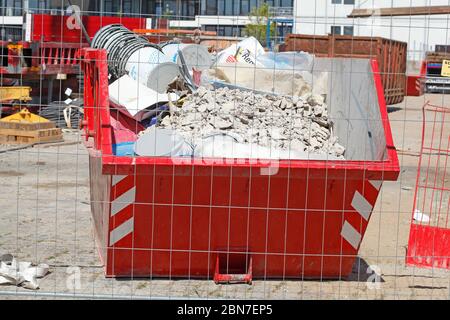 Skip Building Rubble Red skip for building rubble, Germany, Europe Stock Photo - Alamy