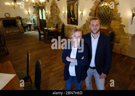 Grimma, Germany. 13th May, 2020. Antonia and Patrick Fischer, operators of the Hotel Kloster Nimbschen, are about to reopen their restaurant after the corona restrictions. The rules for restaurants in Saxony will be further relaxed from 15.05.2020. Credit: Sebastian Willnow/dpa-Zentralbild/dpa/Alamy Live News Stock Photo