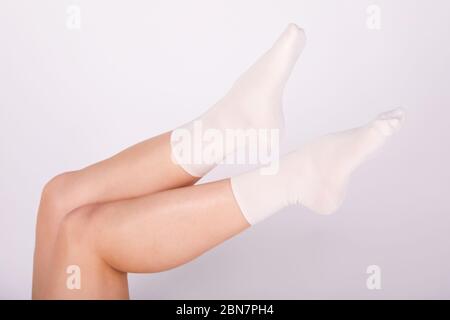 Young girl wearing toe socks hi-res stock photography and images