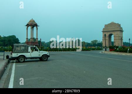 Police car van parked outside an empty India Gate War Memorial in Delhi during lockdown. Stock Photo