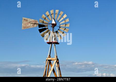 Classic, multi-bladed Windpump 'The Aermotor, Chicago Co.', originally used for pumping well water. Stock Photo