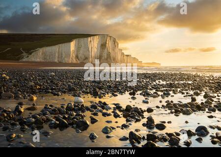 Sunrise over the Seven Sisters Cliffs and shingle beach, Eastbourne, East Sussex, England, United Kingdom, Europe Stock Photo
