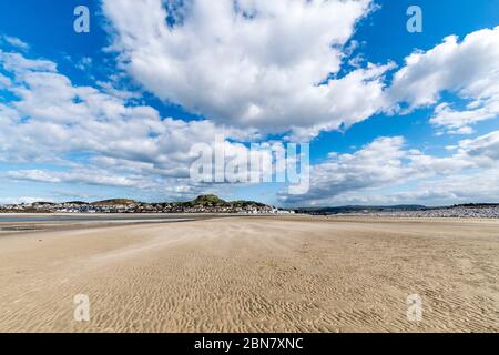 Conwy Morfa beach on the North Wales coast looking towards Deganwy Stock Photo
