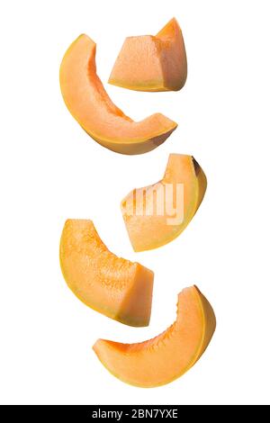 Flowing melon fruit isolated on white background with shallow depth of field Stock Photo