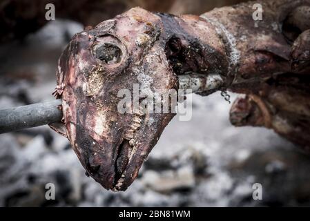 Goat being roasted on a spit in Corfu, Greece. Stock Photo