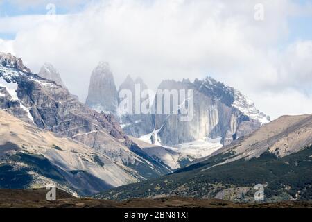 The Cordillera Paine mountain range with the three Torres del Paine. (North, or Torres Monzino, tower to the right.) Stock Photo