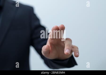 Businessman pressing button. Innovation technology internet business concept. Space for text Stock Photo