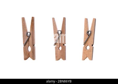 Set of decorative wood beige clothespins isolated on white background. Cloth hanger. Macro, closeup Stock Photo