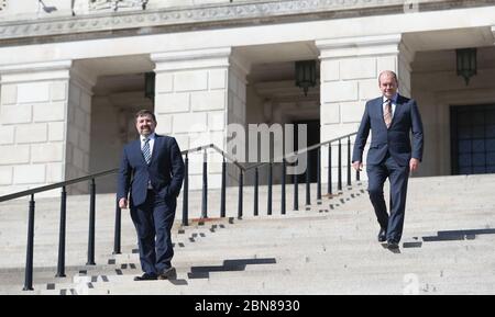 Northern Ireland Health Minister Robin Swann and Chief Medical Officer Michael McBride before a press conference at Parliament Buildings in Stormont, Belfast. Stock Photo