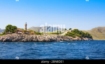 Lighthouse on island in summersunny day, Mallorca, Balearic island, Spain Stock Photo