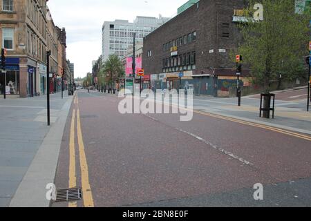 Looking down Sauchiehall Street in Glasgow, which is deserted and empty, during the Covid-19 and coronavirus pandemic and there is no people or traffic as the whole country is in a lockdown and stay at home mode to combat this virus that is sweeping through Britain. May 2020. ALAN WYLIE/ALAMY© Stock Photo