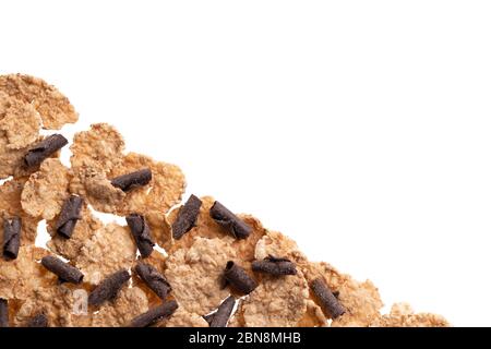 Tasty homemade granola isolated on white. Corn flakes, fresh granola, muesli with chocolate flakes. Bran cereal, chocolate curls. Healthy snack, natur Stock Photo