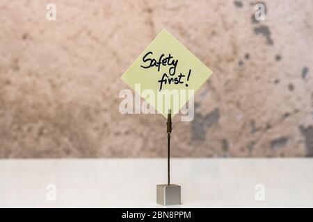 Safety first handwriting text on memo post reminder isolated with copy space. Stock Photo