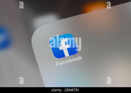 Facebook social media app logo on screen of iPhone 6 Plus smart phone ...