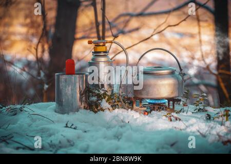 Cooking while hiking with a backpack. Stock Photo