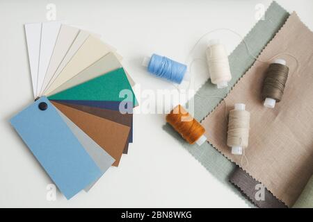 High angle view of colored pattern and threads lying on the table for tailoring Stock Photo