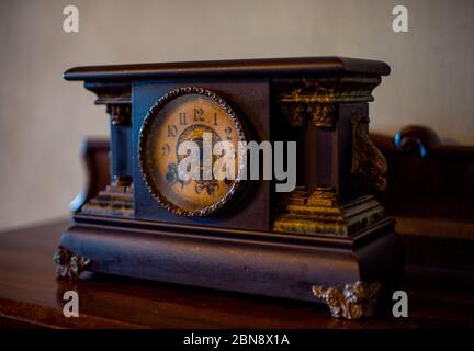 Old wooden clock black and gold Stock Photo