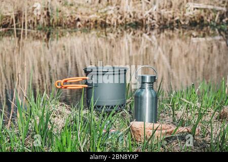 Cooking while hiking with a backpack. Stock Photo