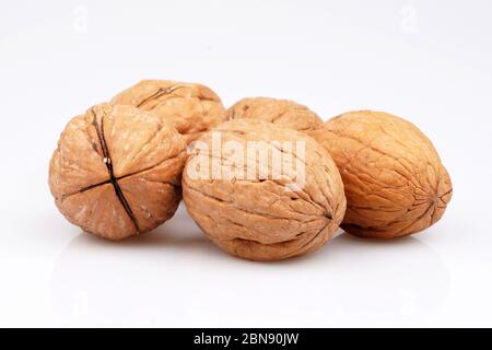 Some Organic walnut on white background Stock Photo