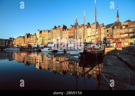 Honfleur, France - December 30, 2016 : Morning light on building at Honfleur port is a truly picturesque and one of charming harbour in France Stock Photo