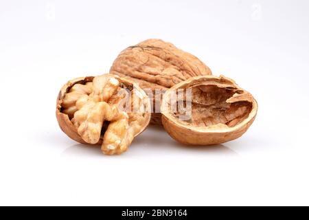 Organic walnuts and cracked walnut, isolated on white background Stock Photo