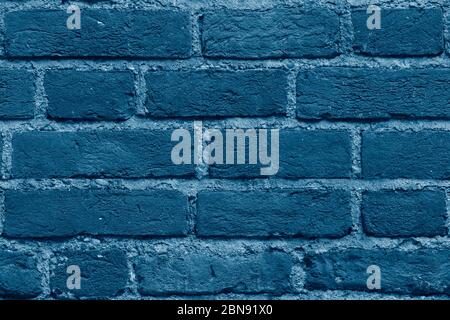 Seamless classic blue brick wall texture background. Pattern of weathered old cracked brickwall. Stacked stones wall. Home or office design backdrop. Stock Photo