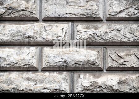 Rock gloomy pattern background. Grey masonry, stonework texture. Concrete different gray stone surface. Geometric aged urban dirty rough grainy stone Stock Photo