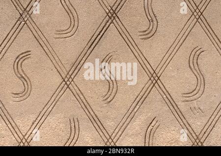 Concrete wall texture with ornament. Stone surface background. Abstract ornament pattern and cement texture, vintage background. Abstract cement wall Stock Photo