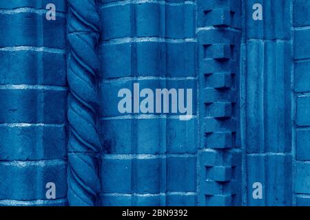 Brick work wall with ornament on old building. Dark blue brick wall texture architecture background. Pattern of weathered antique brickwall. Stacked s Stock Photo