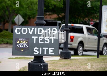 Kennesaw, GA, USA. 13th May, 2020. Free COVID-19 testing continues for anyone who needs at several sites throughout Georgia, supervised by troops from the Georgia Army National Guard and performed by medical staff from Augusta University.Pictured: testing site at Kennesaw State University parking deck Credit: Robin Rayne/ZUMA Wire/Alamy Live News Stock Photo