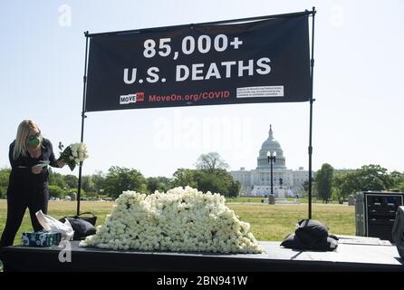 Washington, United States. 13th May, 2020. MoveOn.org holds a protest calling attention to the Trump administration's handling of the Coronavirus (COVID-19) pandemic on the National Mall in Washington, DC, on May 13, 2020. Photo by Kevin Dietsch/UPI Credit: UPI/Alamy Live News