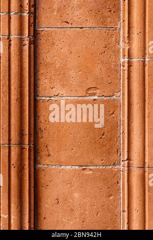 Brick work wall with ornament on old building. Red brick wall texture architecture background. Pattern of weathered antique brickwall. Stacked stones Stock Photo